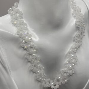 White choker style necklace with intricate pattern